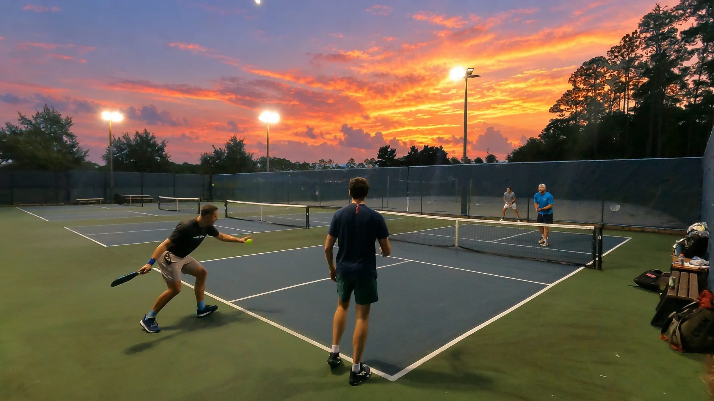 Palm Volley players on the top court at sunset during the final week